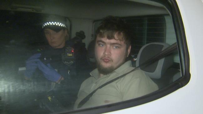 Austin Smith, right, following his arrest. Picture: Nine News.