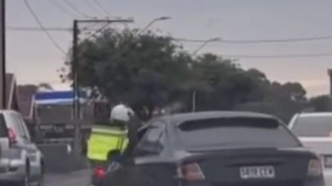 The vision shows the car repeatedly driving very close to the delivery rider. Picture: Just Adelaide Things