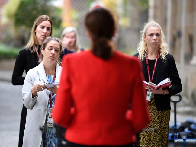 Reporters listen to Queensland Premier Annastacia Palaszczuk during a press conference at Parliament House in Brisbane yesterday. Picture: AAP