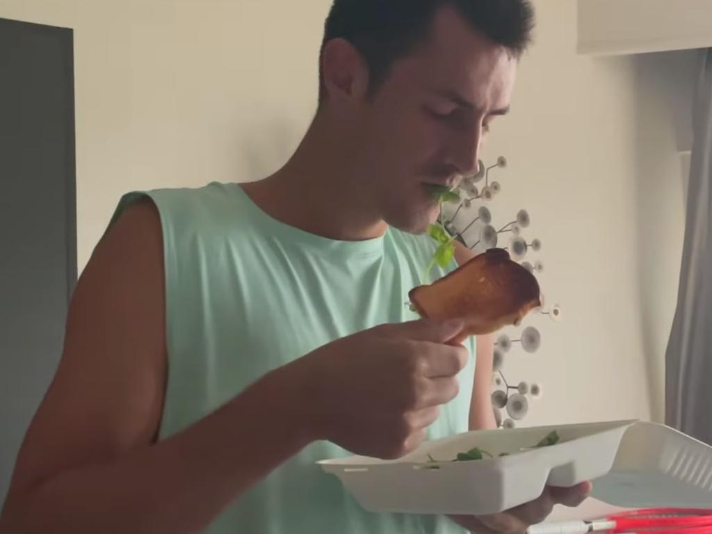 Bernard Tomic looking very unenthused with his toast.