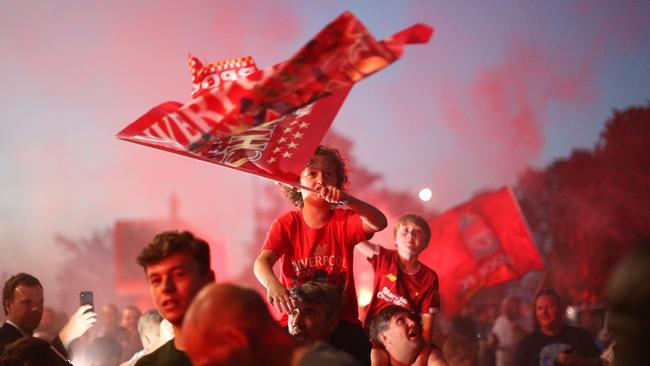 Liverpool fans paint the town red as their team clinch the English Premier League title