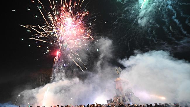 Revellers watch fireworks on the Gianicolo Hill, at the Garibaldi statue, during the new year celebration in Rome. Picture: AFP