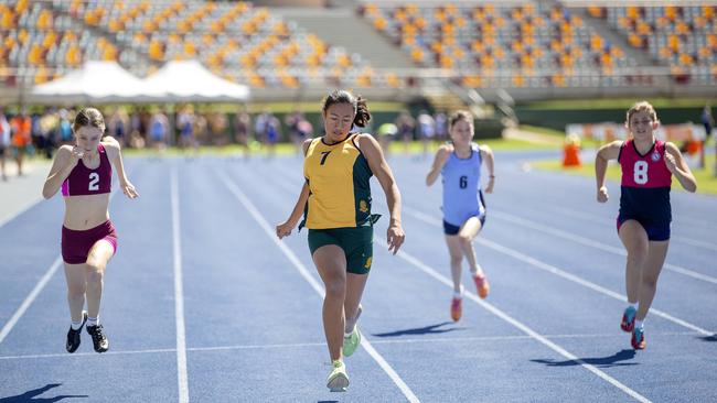 Mali Schwarz, 12, Clayfield, puts in a big 100m effort at the QGSSSA schoolgirl athletics sports carnival at the Queensland sport and Athletics Centre.(Image Sarah Marshall)