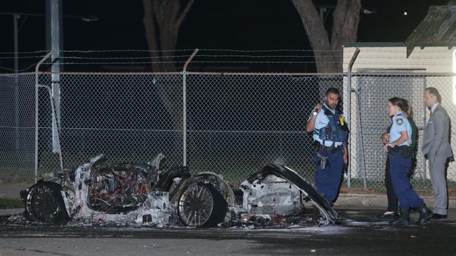 An Audi sports car used in the shooting at Lomond St, Guildford West, was dumped and set on fire at Merrylands Park. Picture: Bill Hearne