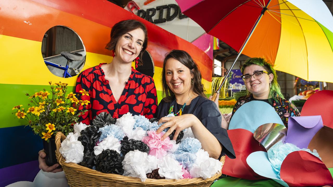 Helping prepare the Pride float are (from left) Courtney Ruler, Annette Bromdal and Mickey Berry for the grand parade of Carnival of Flowers 2022. The float is supported by MOSAIC and Carers Queensland. Picture: Kevin Farmer