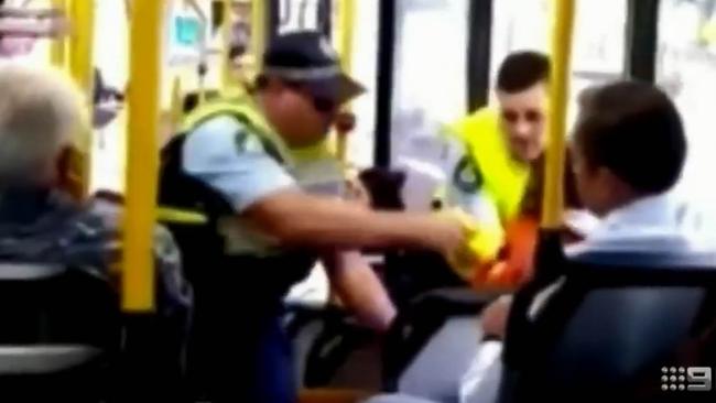 Police taser the passenger on a Sydney bus after repeatedly asking him to get off. Picture: 9 News