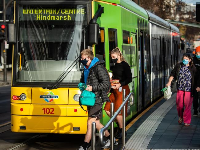 People back in the city after lockdown has ended, on July 28th, 2021, getting off the tram on North Terrace in Adelaide.Picture: Tom Huntley