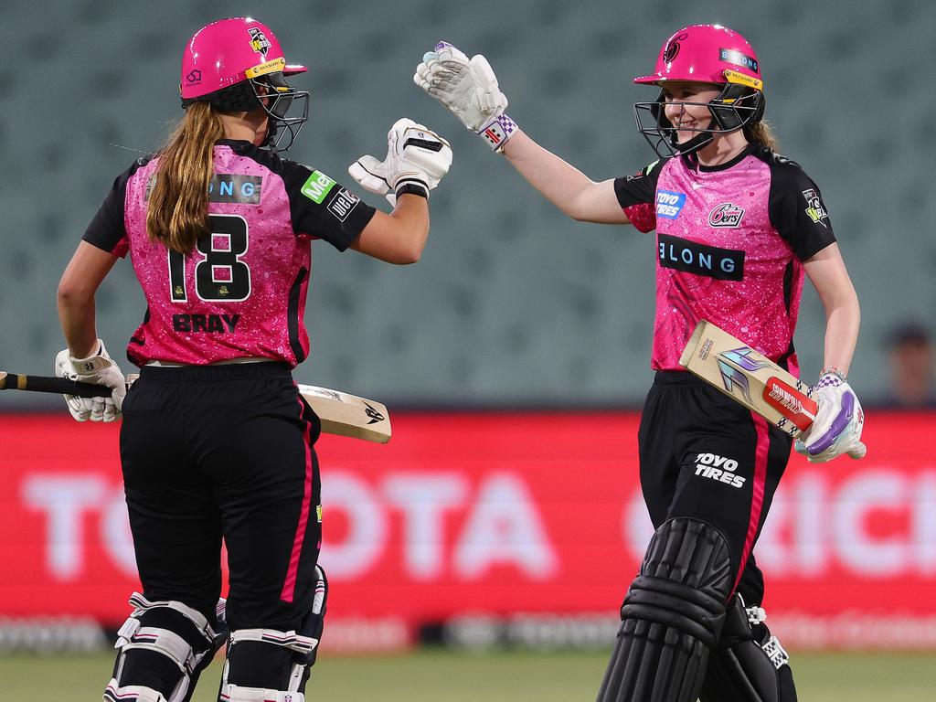 Caoimhe Bray and Sarah Bryce after their winning partnership against the Melbourne Renegades in the Sixers’ first match of WBBL season 10. Picture: Sarah Reed/Getty Images