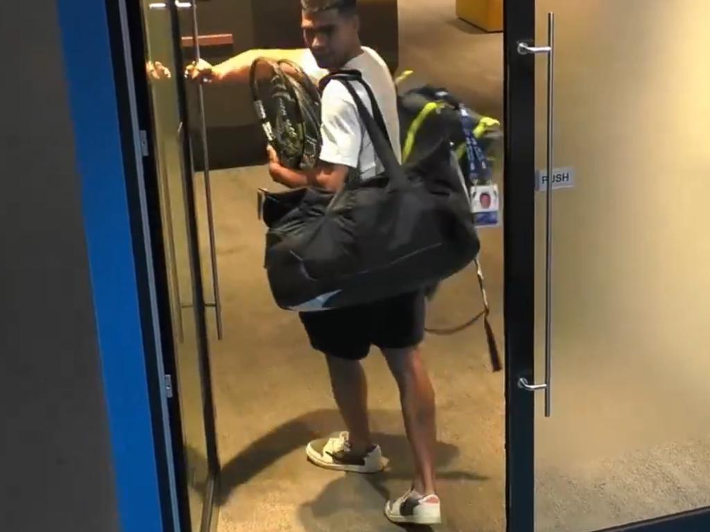 Carlos Alcaraz walks into Melbourne Park with his kit bag. Photo: X