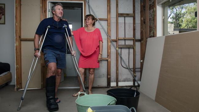 Mark and Darani Cumming in their badly damaged Upper Coomera home. Picture: Glenn Campbell.