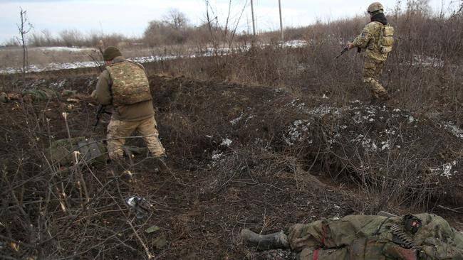 Ukrainian soldiers in the aftermath of deadly fighting near the village of Zolote, in the Lugansk region, on Sunday. Picture: AFP