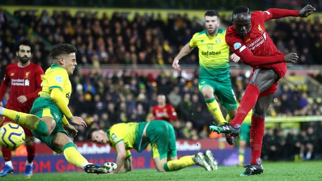Liverpool’s Sadio Mane, right, scores the only goal of the game against Norwich City at Carrow Road. Picture: Getty Images
