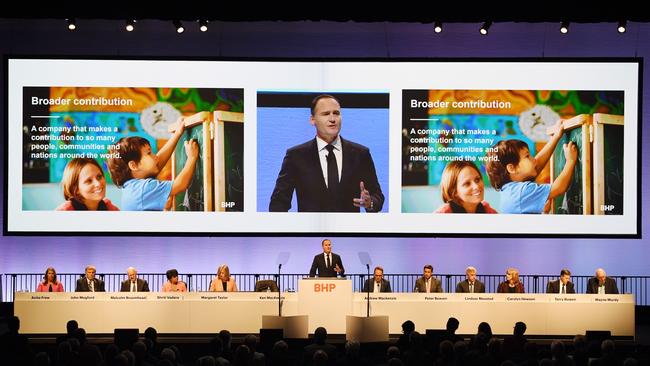 Incoming BHP chief executive officer Ken MacKenzie (centre) has vowed to focus on five strategic pillars: safety, the portfolio, capital discipline, capability and culture and “social licence to operate”. Photo: AAP