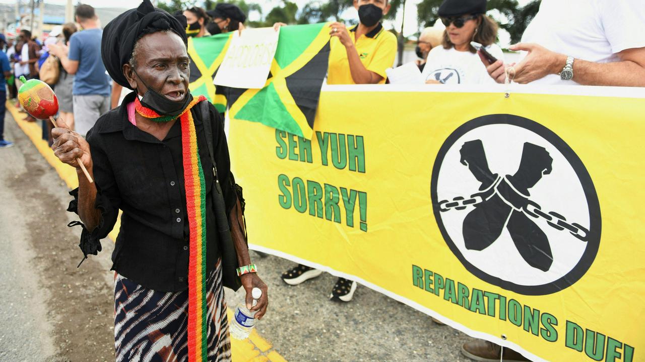 People calling for slavery reparations protest outside the entrance of the British High Commission during the visit of the Duke and Duchess of Cambridge in Kingston, Jamaica on March 22, 2022. Picture: AFP