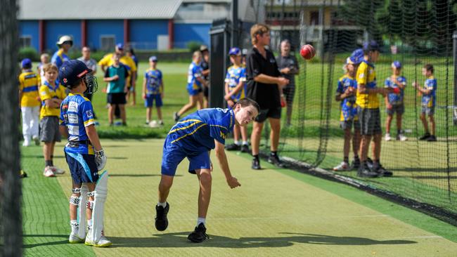 Australian international cricketer Adam Zampa oversees a skills clinic at the Mortimer Oval cricket nets.