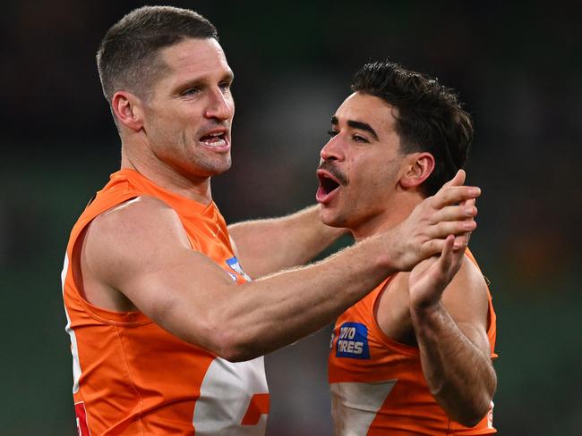 Toby Bedford (right) has become one of the AFL’s stingiest taggers. Picture: Morgan Hancock/AFL Photos/via Getty Images