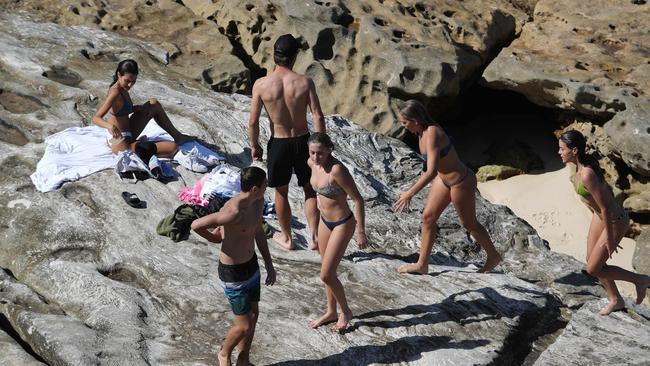 Despite warnings young people continue to gather in Sydney’s eastern suburbs. Pictured is Mackenzies Beach which is officially closed. Picture Rohan Kelly