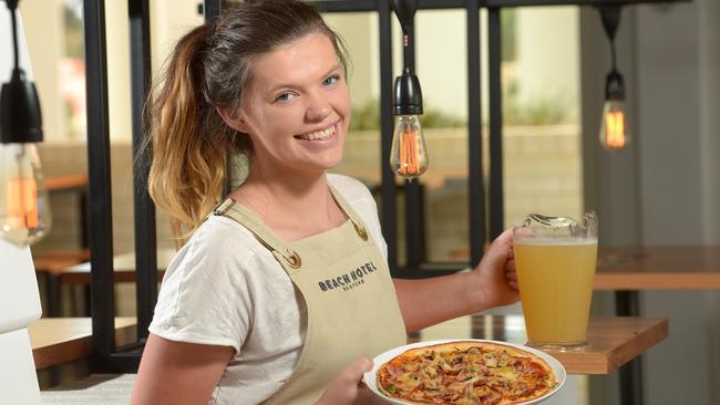 The Beach Hotel Seaford’s staffer Wednesday White with a pizza and jug of cider. Picture: Keryn Stevens