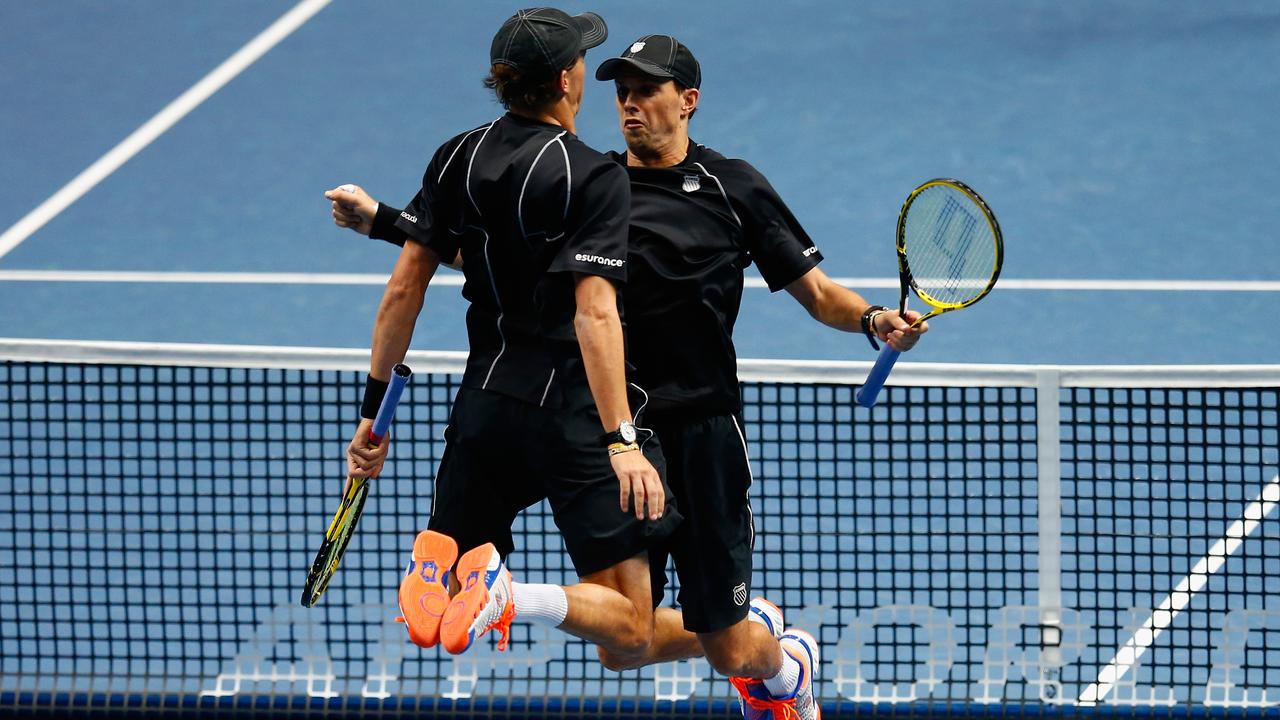 LONDON, ENGLAND - NOVEMBER 15: Bob Bryan of the United States and Mike Bryan of the United States celebrate match point in the doubles semi-final match against Julien Benneteau of France and Edouard Roger-Vasselin of France on day seven of the Barclays ATP World Tour Finals at O2 Arena on November 15, 2014 in London, England. (Photo by Julian Finney/Getty Images)