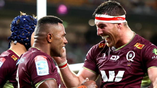 BRISBANE, AUSTRALIA - APRIL 02: Filipo Daugunu of the Reds celebrates with team mates after scoring a try during the round seven Super Rugby Pacific match between the Queensland Reds and the ACT Brumbies at Suncorp Stadium on April 02, 2022 in Brisbane, Australia. (Photo by Albert Perez/Getty Images)