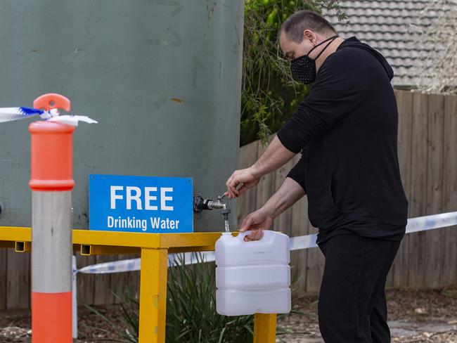 Residents in areas affected by contamination to the water supply can collect drinking water from water stations. Residents collecting water at Griff Hunt Reserve, Croydon North. Joe ( with held surname) gets a supply of drinking water for his home. Picture: Sarah Matray