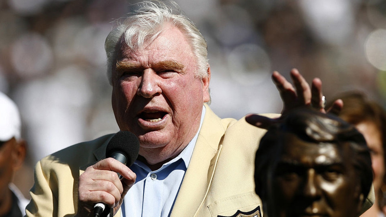 John Madden taps his bust during his Hall of Fame ceremony before the game as the Oakland Raiders defeated the Arizona Cardinals by a score of 22 to 9 at McAfee Coliseum, Oakland, California, October 22, 2006. (Photo by Robert B. Stanton/NFLPhotoLibrary)