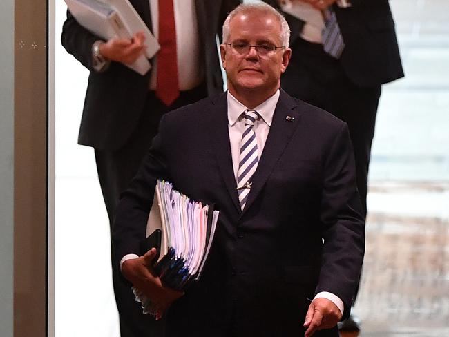 CANBERRA, AUSTRALIA - MARCH 25: Prime Minister Scott Morrison during Question Time in the House of Representatives at Parliament House on March 25, 2021 in Canberra, Australia. The federal government was on Monday set back by new allegationsÃÂ broadcastÃÂ by the Ten Network after pixelated images of unnamed Coalition advisers allegedly engaging in performing lewd sex acts on the desks of female MPs resulting in a Morrison staff member being sacked last night. Additionally, the ABC Network aired a first hand account by an Australian Parliament security guard of what she witnessed on the night Brittany Higgins was allegedly raped in the office of then-defence industry minister Linda Reynolds in early 2019. (Photo by Sam Mooy/Getty Images)