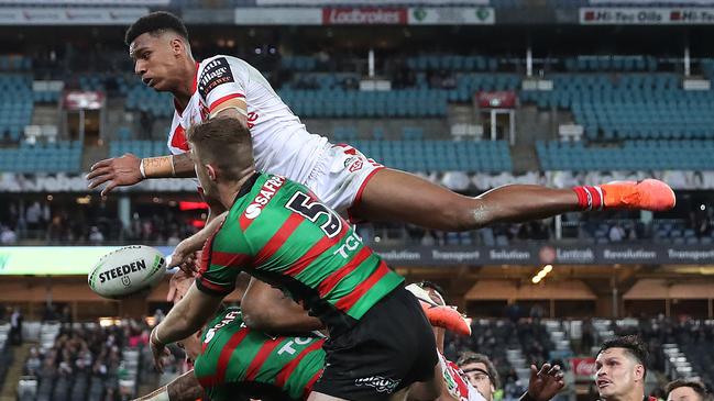 Jason Saab flies high for the Dragons against South Sydney. Picture: Brett Costello