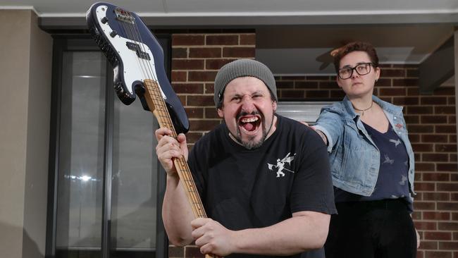 Mike Conomy with the guitar he used to defend himself and partner Annabelle Sutton. Picture: David Crosling