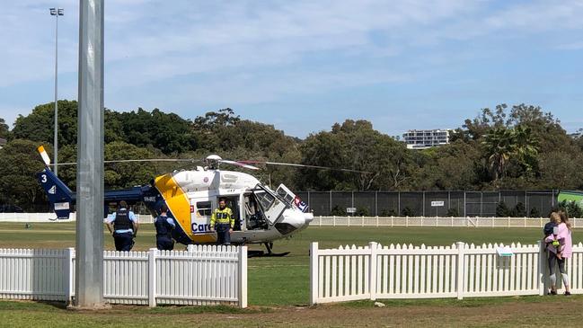 A CareFlight helicopter on L.M. Graham Reserve at Manly. It was called after reports of a man having a seizure in the Andrew 'Boy' Charlton Swim Centre at Manly. Picture: Julie Cross