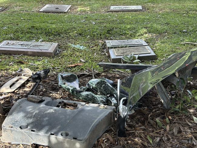 A car left the road and crashed through a hedge and over Memorial plaques at Allambe Memorial Park in Nerang.