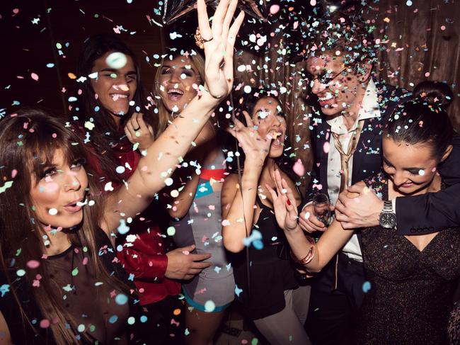 Group of friends dancing and enjoying a night out in the club.