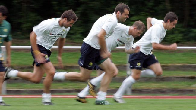 Lucas Neill, left, and Mark Viduka train together in 2006. Picture: Gregg Porteous