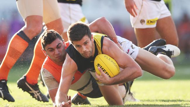 Richmond's Trent Cotchin tackled by Giants Tim Taranto during AFL match between the GWS Giants and Richmond Tigers at Giants Stadium. Picture. Phil Hillyard