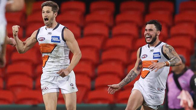 Callan Ward celebrates after kicking the goal that sealed victory for the Giants against Essendon. Picture: Michael Klein