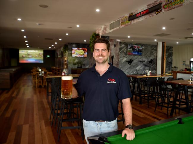 OBJ's Sports Bar assistant manager Btrandon (Banjo) Webster with a stein of beer. Picture: Evan Morgan