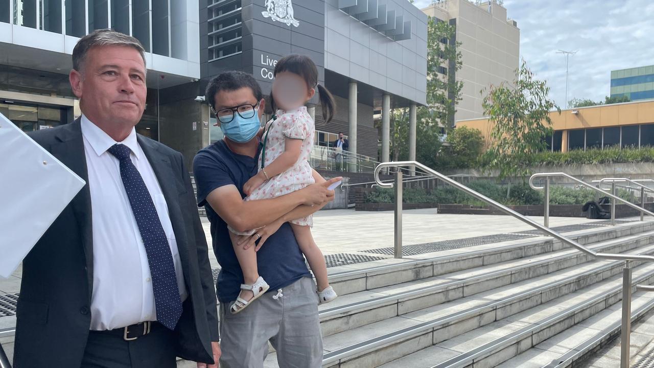 Xuan Su, 40, used his young daughter to shield his face from cameras.