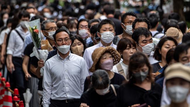 People line up to offer condolences at Shinzo Abe’s funeral at Zojoji Temple in Tokyo. Picture: Getty Images