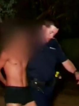 One of the five youths is taken into custody. Picture: Nine News