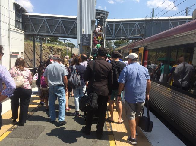 Commuters stranded at Bowen Hills station after six train lines were suspended following severe thunderstorms. Picture: John O'Brien