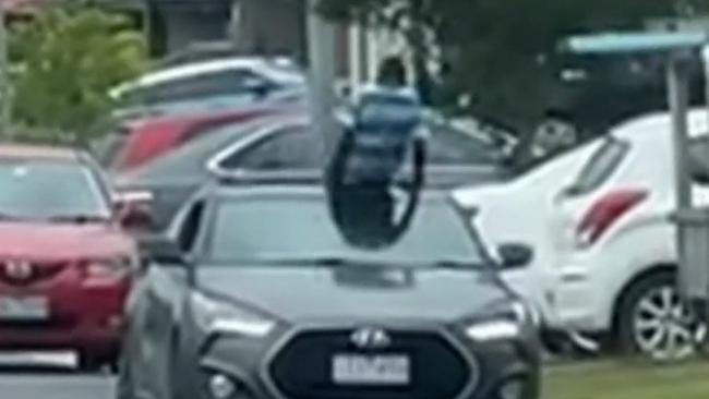 The boy then climbs back into the car through the sunroof. Picture: Channel 9