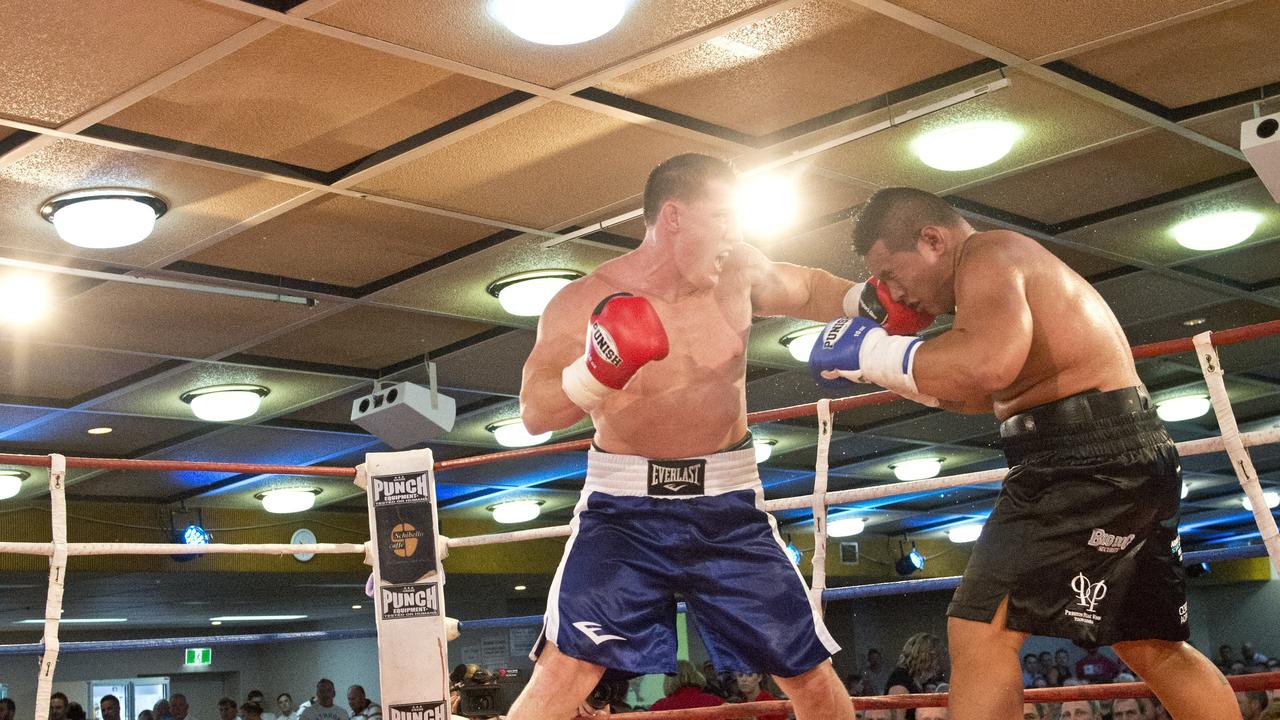 Paul Gallen and Herman Ene-Purcell fight it out in Toowoomba. Friday, Jan 29, 2016.