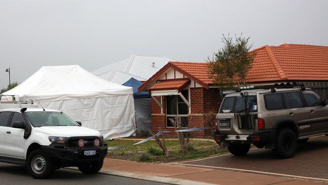 Forensic Services attend the scene where three people were found dead in Ellenbrook, Perth, Sunday, July 15, 2018. Picture: AAP/Trevor Collens.