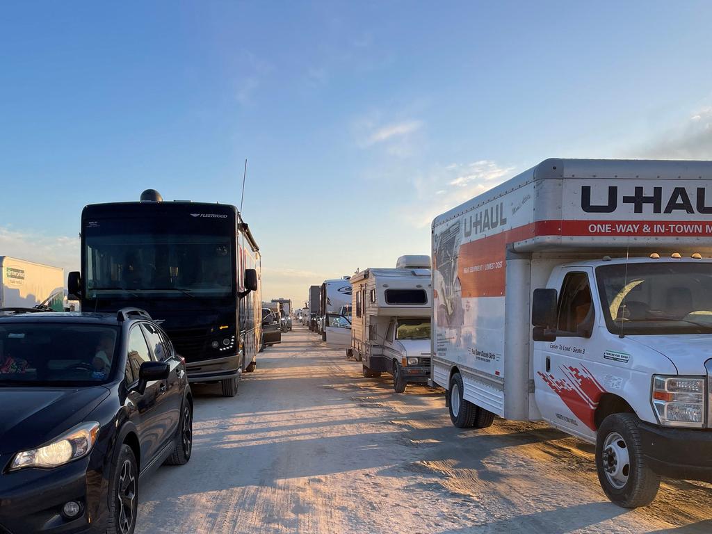 Vehicles line up to leave the site of the annual Burning Man Festival. Picture AFP