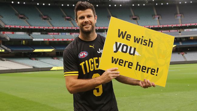 AFL Round 1. Richmond vs Carlton at the MCG..  20/03/2020.  Trent Cotchin of the Tigers holds a sign for the fans pre game   . Pic: Michael Klein