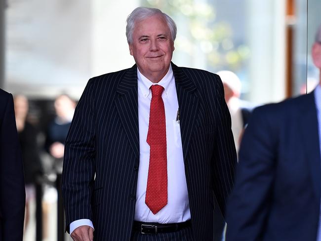 Businessman and former federal MP Clive Palmer (centre) leaves the Planning and Environment Court in Brisbane, Friday, July 21, 2017. Mr Palmer attended a mediation over legal matters relating to his collapsed Townsville nickel refinery. (AAP Image/Dan Peled) NO ARCHIVING