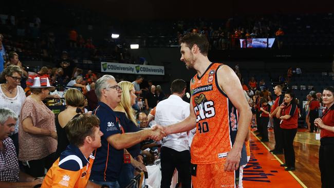 Cairns Taipans Captain Alex Loughton shakes hands with Taipans President Troy Stone after a game at the Cairns Convention Centre. PICTURE: BRENDAN RADKE