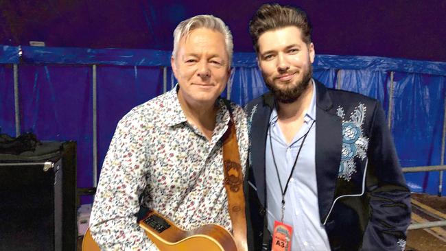 Tommy Emmanuel with Jeremy Dylan, documentary filmmaker of 'Tommy Emmanuel: The Endless Road', backstage at Byron Bay Bluesfest in April 2019. Picture: supplied