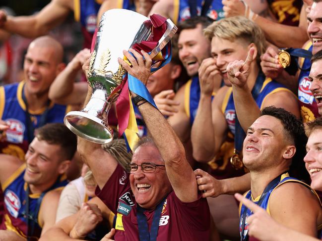 MELBOURNE, AUSTRALIA - SEPTEMBER 28: Chris Fagan, Senior Coach of the Lions celebrates with his players after winning the AFL Grand Final match between Sydney Swans and Brisbane Lions at Melbourne Cricket Ground, on September 28, 2024, in Melbourne, Australia. (Photo by Cameron Spencer/AFL Photos/via Getty Images)