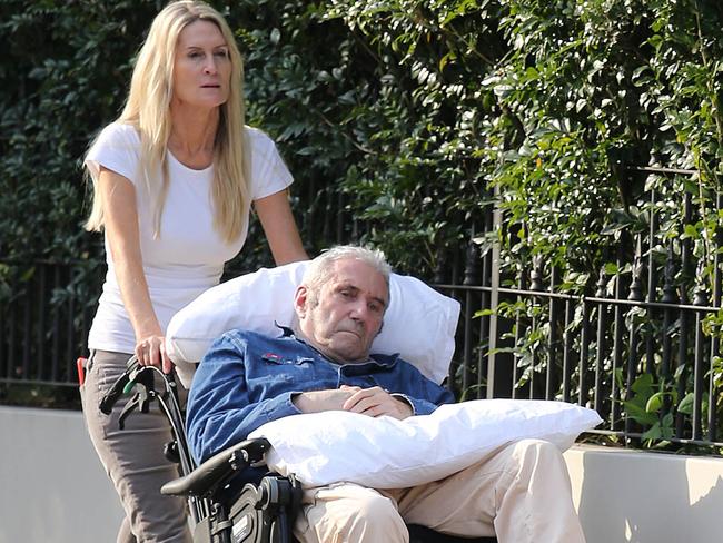 Simmone Logue takes Miller for a walk during his illness in August 2015.